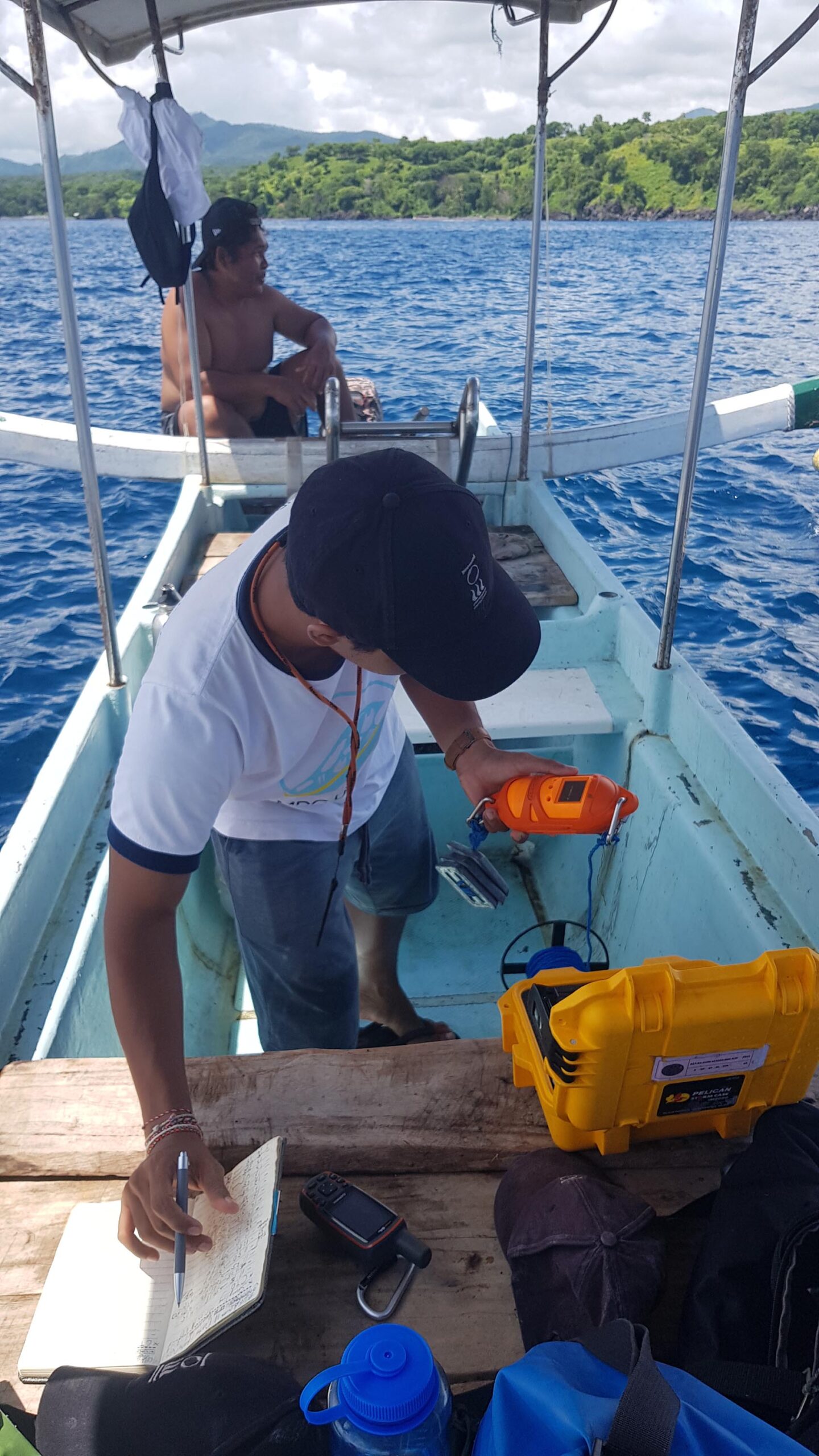 A student from Udayana University reading information from a CTD logger.